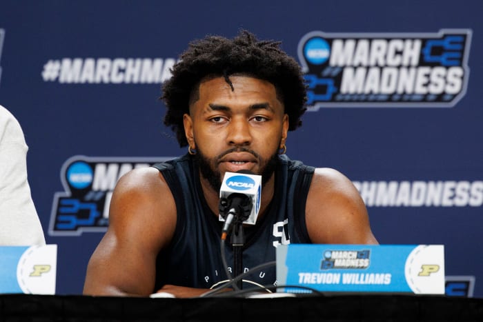 Purdue Boilermakers' Trevion Williams (50) answers questions during practice before the first round of the 2022 NCAA Tournament at Fiserv Forum.